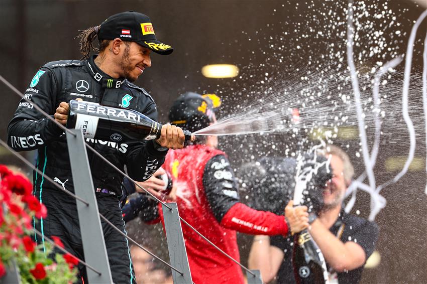 Lewis spraying champagne